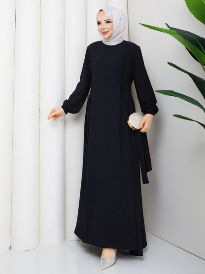 Robe longue ceinturé à boutons dorsaux. Alhambra Couture
